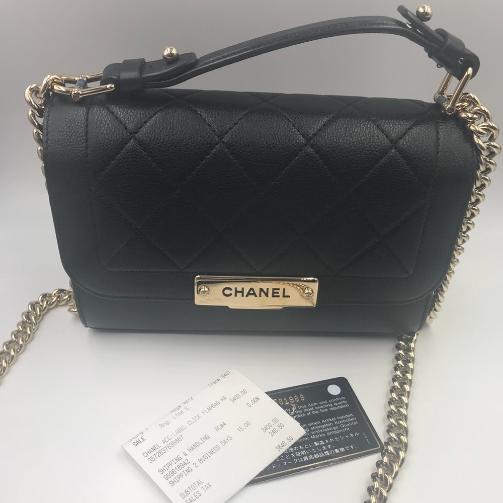 CHANEL
Black Quilted Leather Label Click Flap Bag